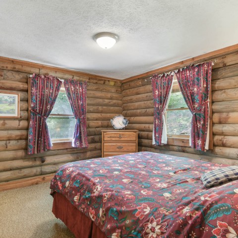 a bedroom with a large bed in a room
