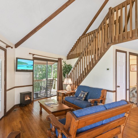 a living room filled with furniture and a window