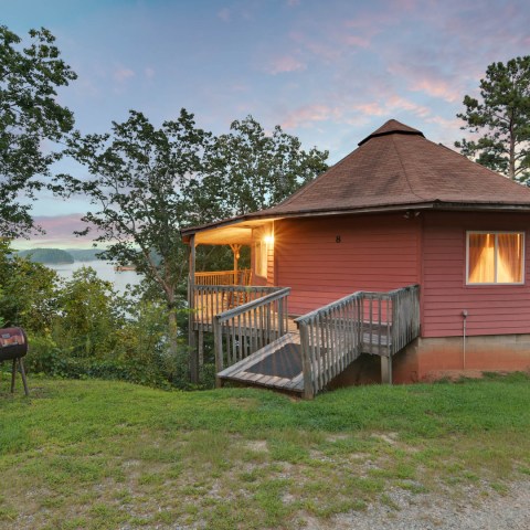 a house on top of a lush green field