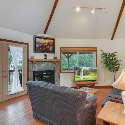 a living room filled with furniture and a fire place