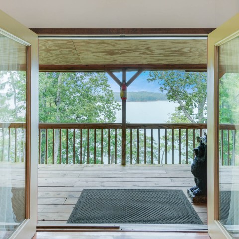 a room filled with furniture and a large window