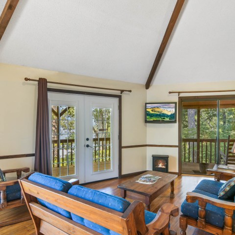 a living room filled with furniture and a blue chair