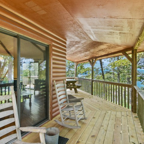 a wooden bench sitting in a chair in a room
