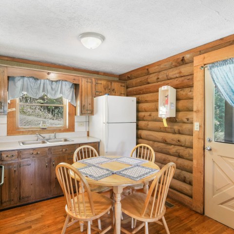 a kitchen with a dining room table