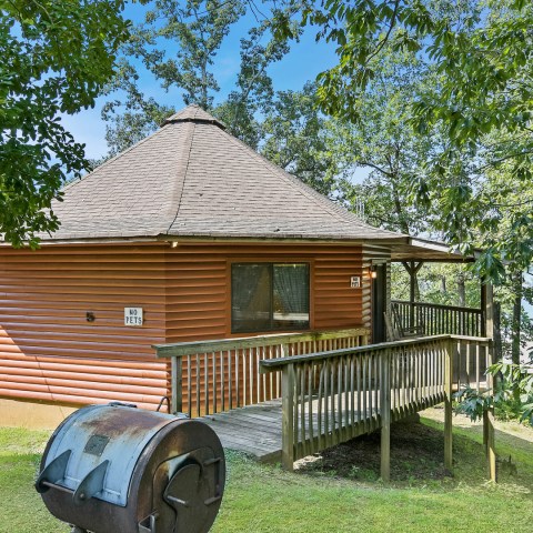 a couple of lawn chairs sitting on top of a wooden house