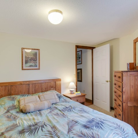 a bedroom with a bed in a room