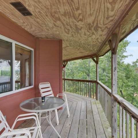 a chair sitting in front of a fence