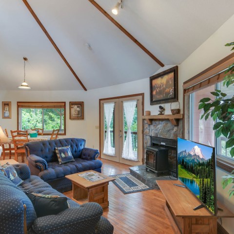 a view of a living room filled with furniture and a fire place