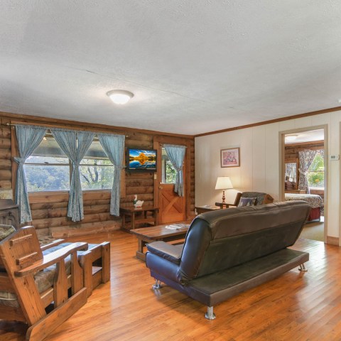 a living room filled with furniture and a fireplace
