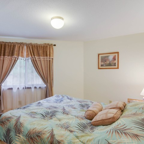 a bedroom with a bed in a room