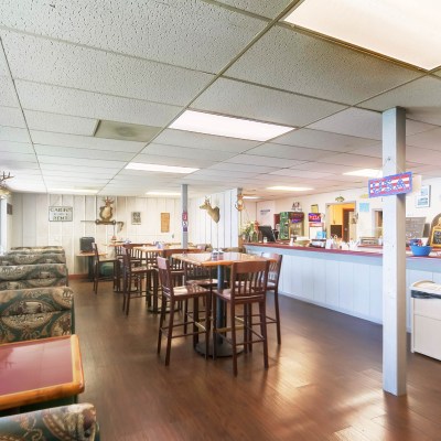 a room filled with furniture and a table in a restaurant