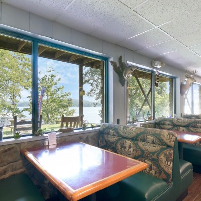 a living room filled with furniture and a large window