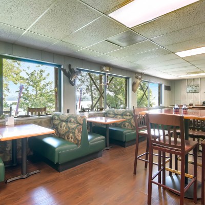a living room filled with furniture and a large window