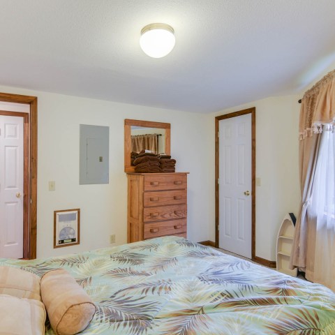 a bedroom with a bed in a room