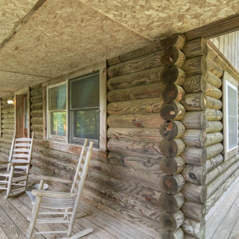 a chair sitting in front of a brick building