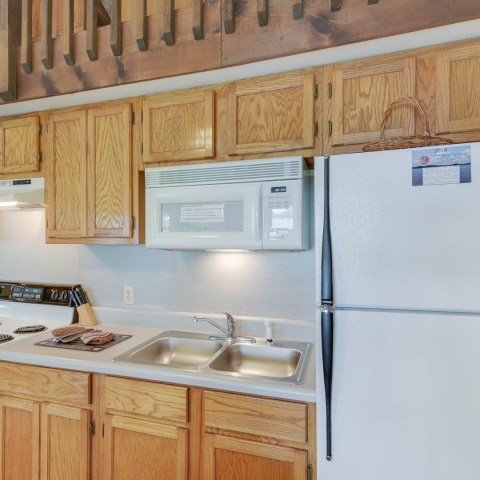 a kitchen with a stove top oven sitting inside of a refrigerator