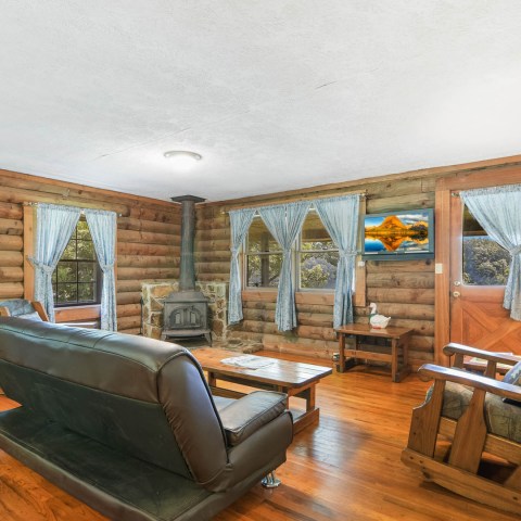 a living room filled with furniture and a fireplace