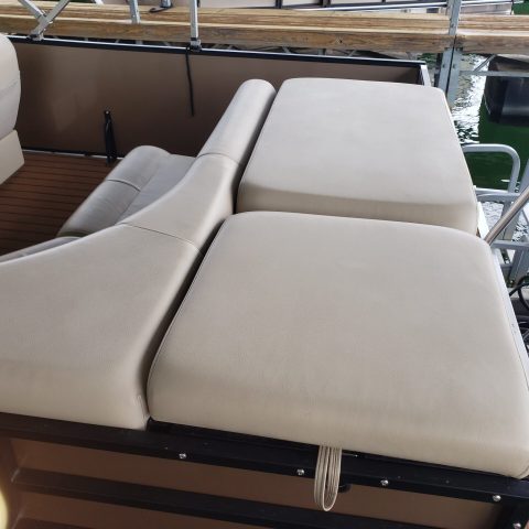 a laptop computer sitting on top of a chair