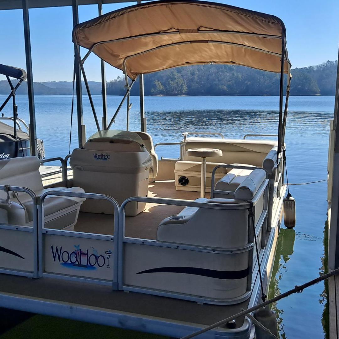a boat is docked next to a body of water