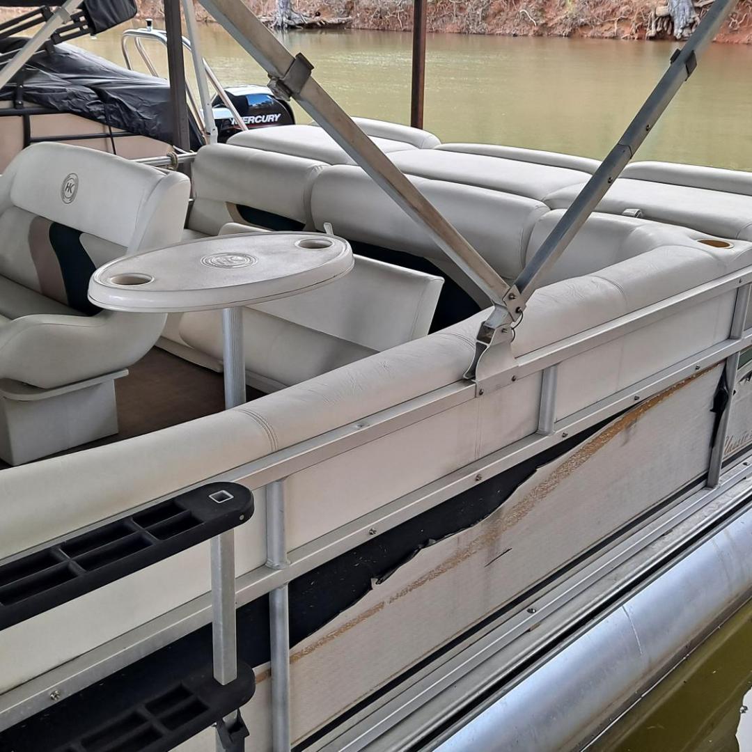 a boat sitting on top of a car