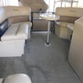 a living room filled with furniture and a large window