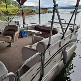 a close up of a boat next to a body of water