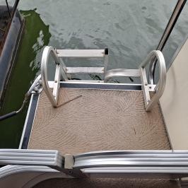 a bird sitting on top of a wooden chair