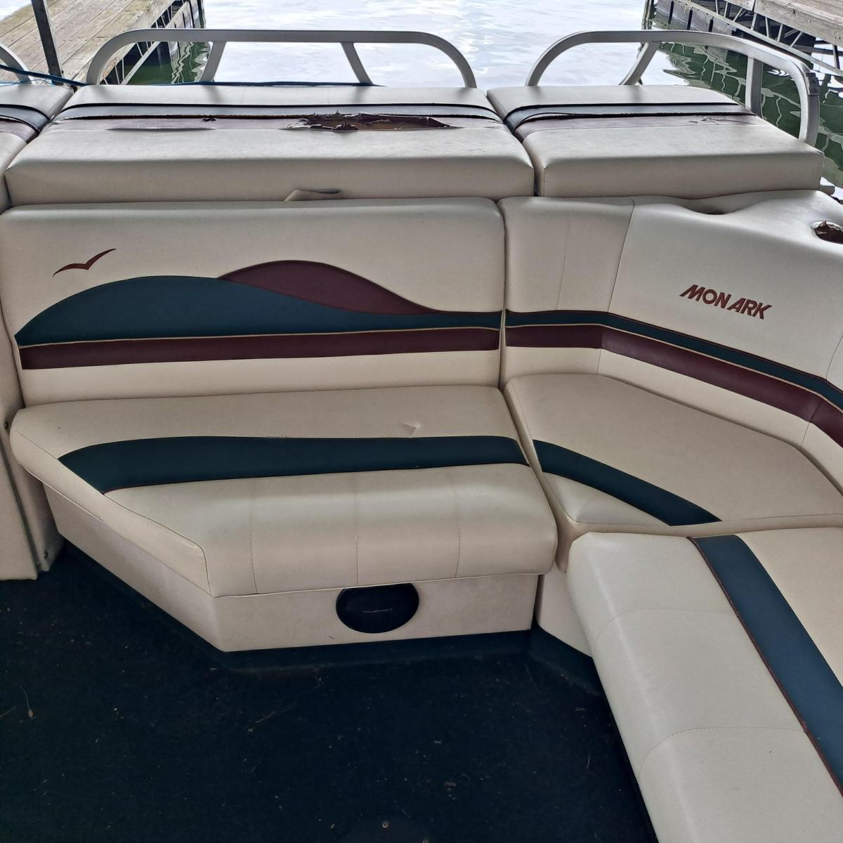 a boat sitting on top of a car