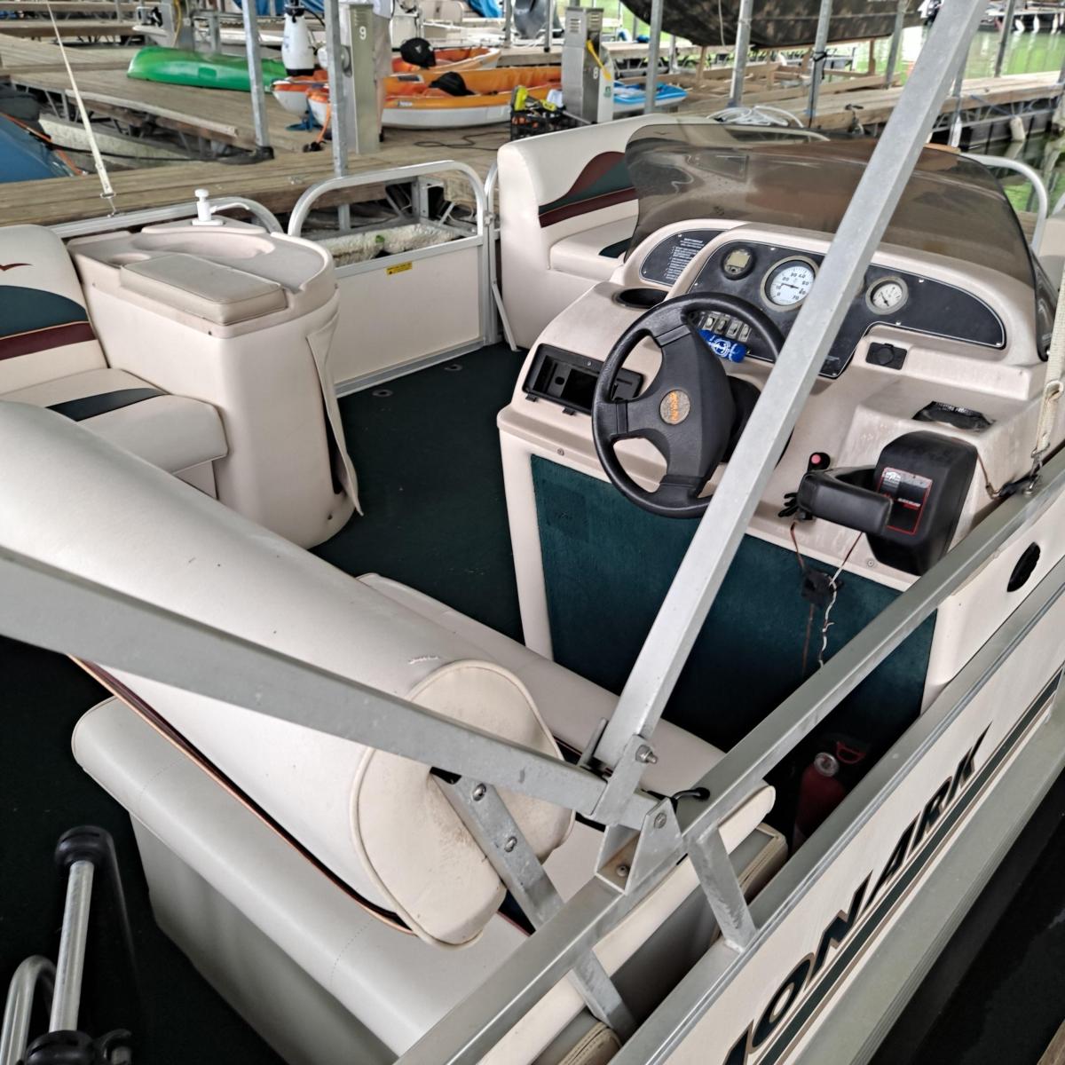 a row of parked motorcycles sitting on top of a car