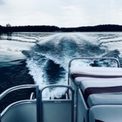 a car parked next to a body of water