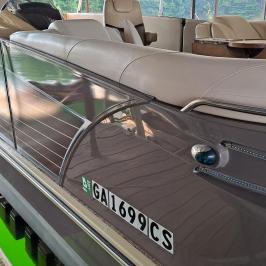 a train cake sitting on top of a wooden fence