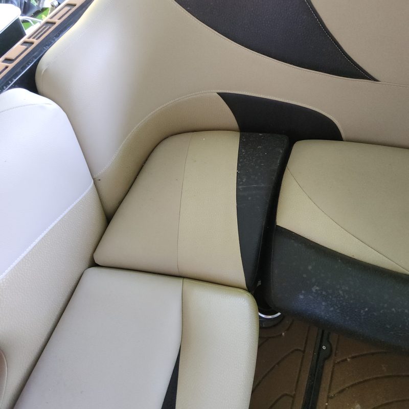 Close-up of beige and black car seat upholstery.