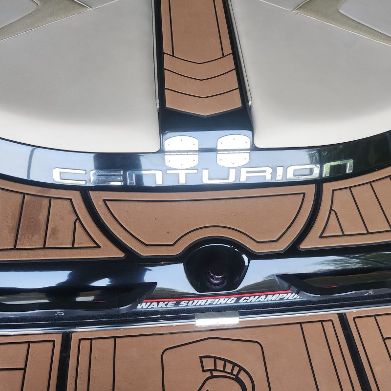 Centurion boat interior with brown and beige seating.