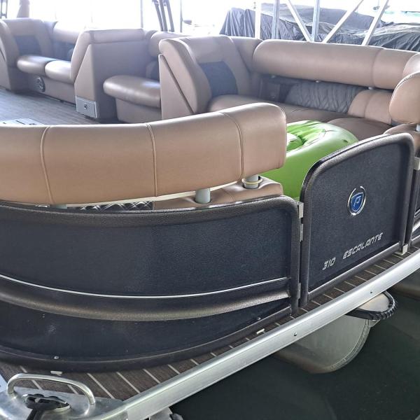 Rear view of a covered pontoon boat with brown seating.